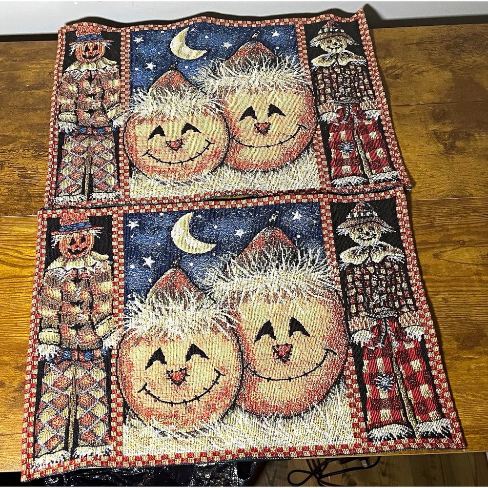 tapestry set of 2 placemats featuring a fall harvest and Halloween theme